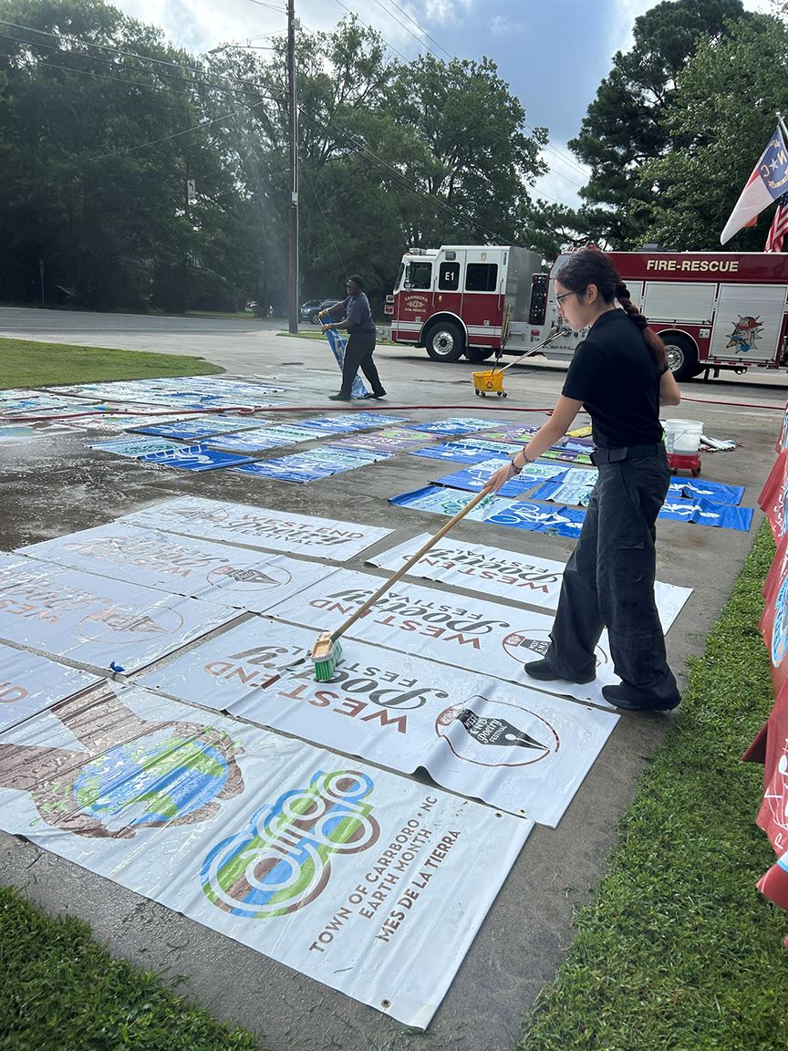 cleaning banners at Carrboro Fire-Rescue