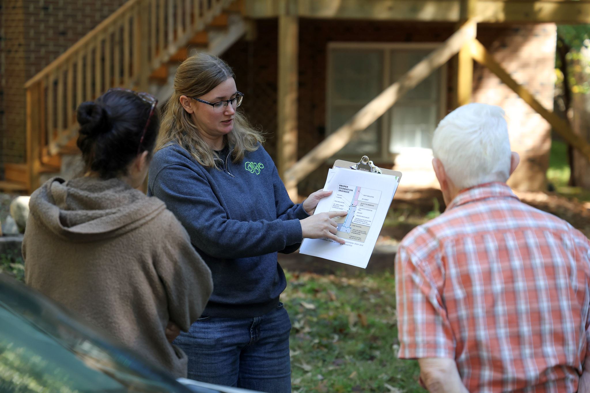 Stormwater staff member in the field talking with residents